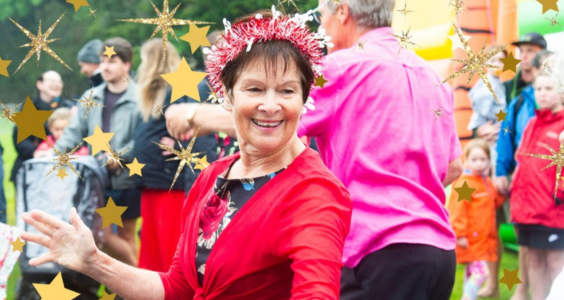 Community members dressed in bright clothing to celebrate the Christmas Parade 2023.