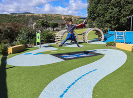 Jumping on in ground trampoline at Lorna Irene Drive Reserve