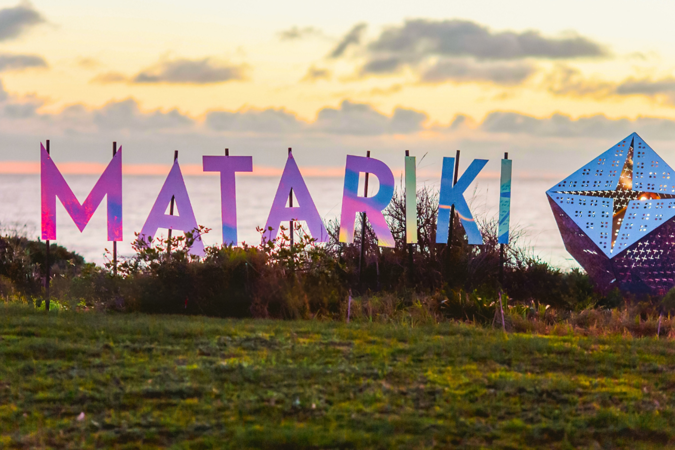 Matariki Reflective Letters Spelling Out Matariki On The Coastline At Sunset