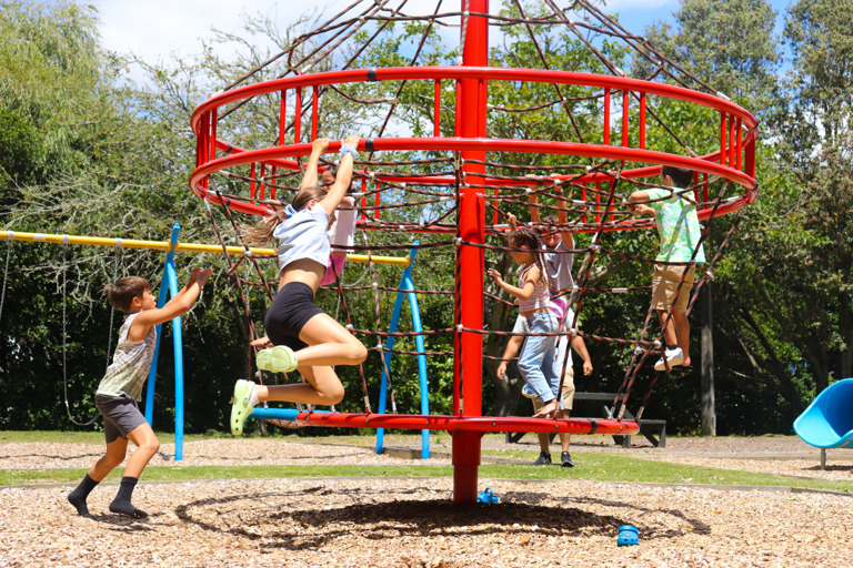 Climbing and swinging at Haruātai Park