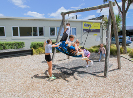 Main Street Playground shared swing