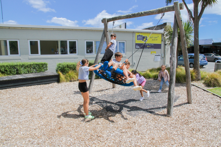 Main Street Playground shared swing