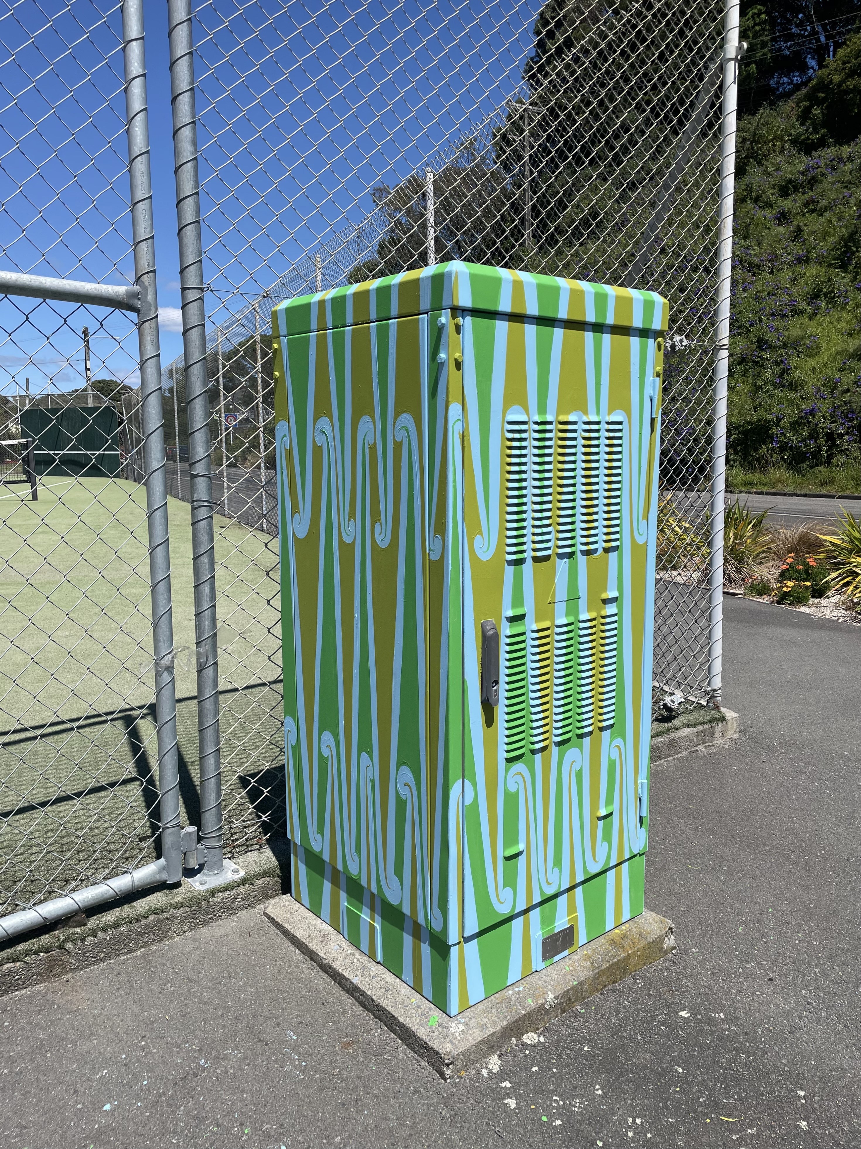 Front and side view of art cabinet 'Pūhoro', painted by Miriama Grace-Smith